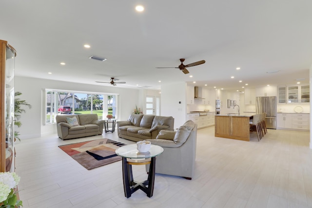 8579 SE Sabal St, Hobe Sound, FL 33455 - living area featuring a ceiling fan, light wood-type flooring, and recessed lighting