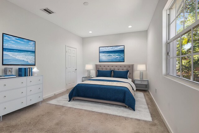 carpeted bedroom with recessed lighting, baseboards, and visible vents