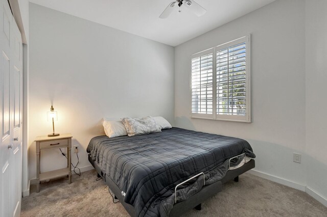 bedroom with baseboards, carpet, and ceiling fan