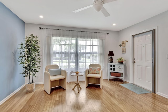 sitting room with recessed lighting, baseboards, ceiling fan, and light wood finished floors