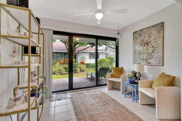 interior space with tile patterned floors and ceiling fan
