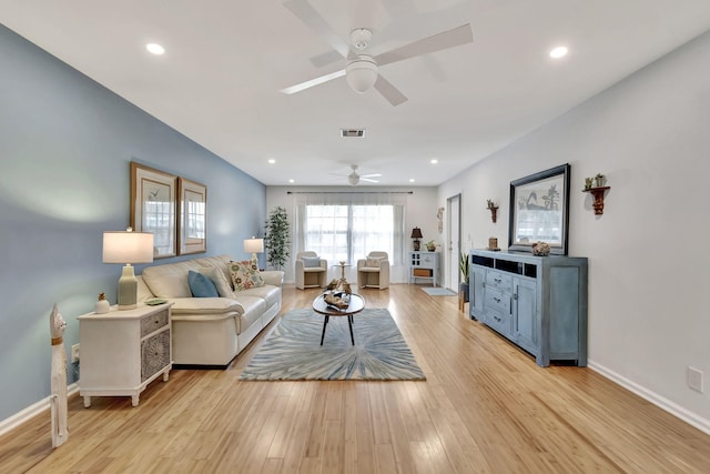 living area featuring baseboards, visible vents, ceiling fan, light wood-style floors, and recessed lighting