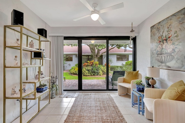 entryway with plenty of natural light, ceiling fan, and tile patterned flooring