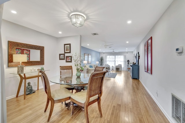 dining area with recessed lighting, visible vents, and light wood finished floors