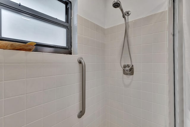 full bathroom with tiled shower