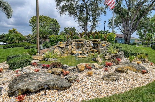 view of yard with a garden pond