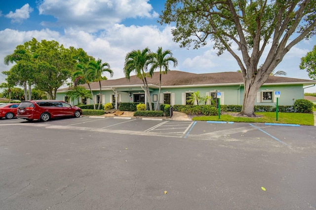 view of property featuring uncovered parking