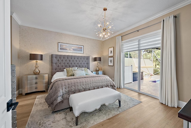 bedroom with wood finished floors, access to exterior, crown molding, and wallpapered walls