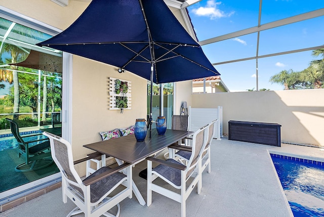 view of patio / terrace featuring a fenced in pool, a lanai, and outdoor dining space