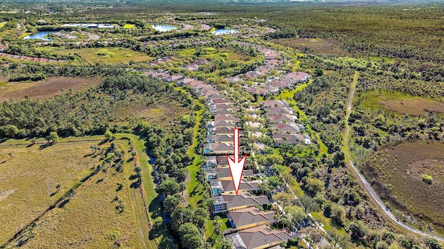 aerial view featuring a residential view and a water view