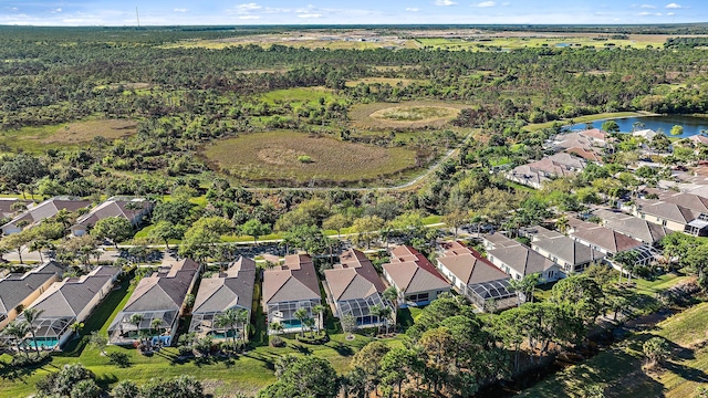 birds eye view of property with a residential view and a water view