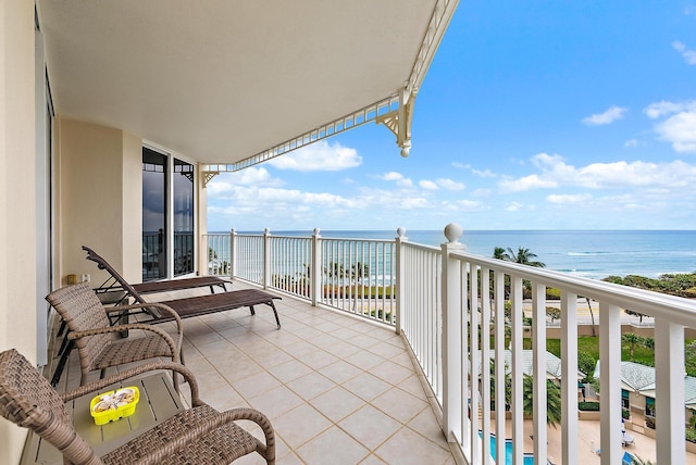 balcony featuring a water view