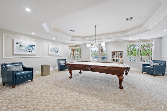 game room featuring a tray ceiling, visible vents, and carpet