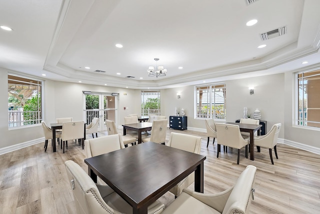 dining area with recessed lighting, visible vents, baseboards, light wood-type flooring, and a raised ceiling