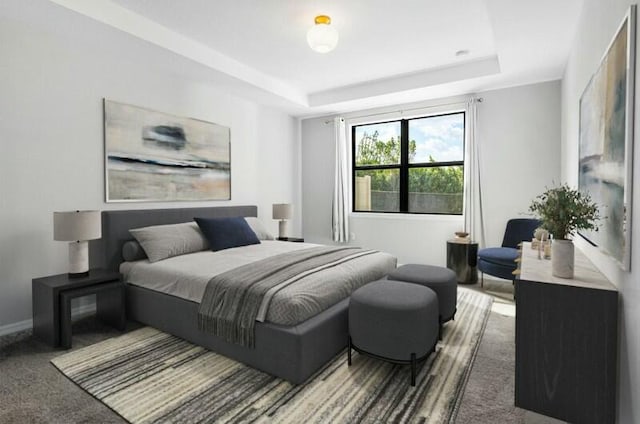 bedroom with carpet floors, a tray ceiling, and baseboards