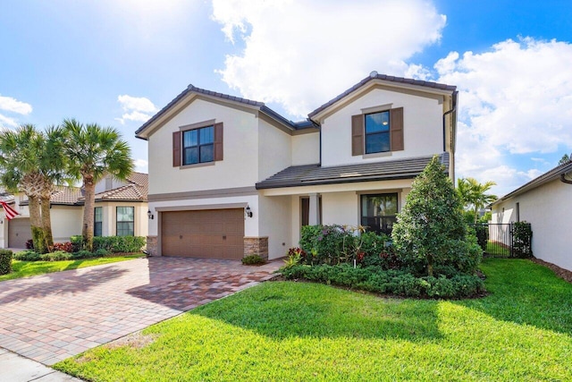 view of front of property with decorative driveway, stucco siding, an attached garage, stone siding, and a front lawn