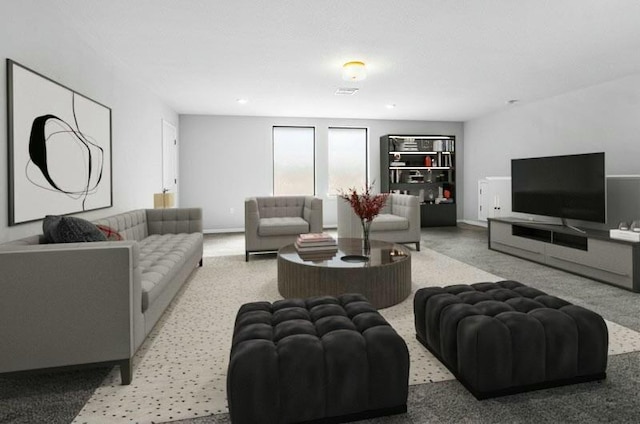 living area with baseboards and visible vents