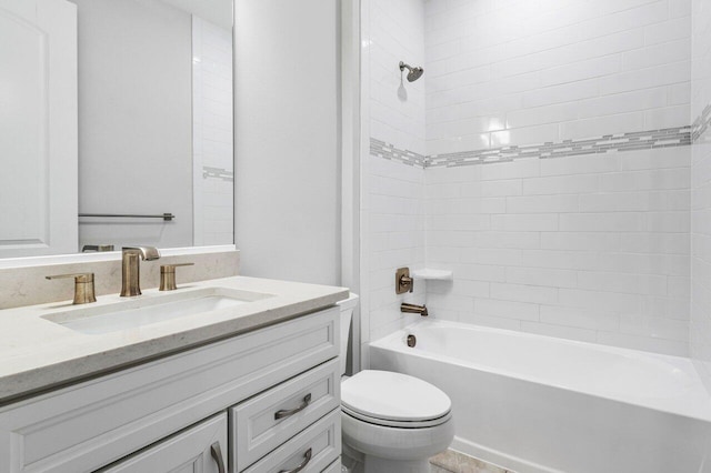 full bathroom with  shower combination, vanity, and toilet