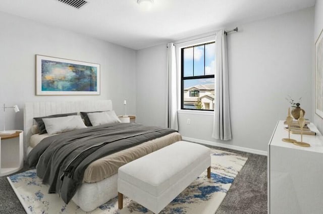 carpeted bedroom featuring visible vents and baseboards