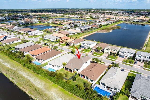 aerial view with a residential view and a water view