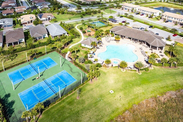 birds eye view of property with a water view and a residential view