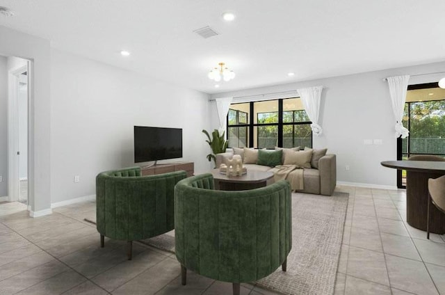 living room with light tile patterned flooring, recessed lighting, visible vents, baseboards, and an inviting chandelier