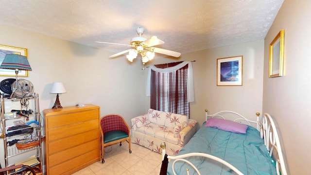 413 European Ln, Fort Pierce, FL 34982 - bedroom with ceiling fan, light tile patterned flooring, and a textured ceiling