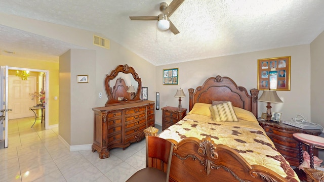 413 European Ln, Fort Pierce, FL 34982 - bedroom featuring light tile patterned floors, visible vents, lofted ceiling, ceiling fan, and a textured ceiling
