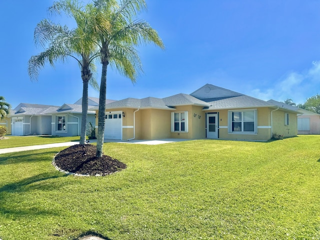 413 European Ln, Fort Pierce, FL 34982 - ranch-style house featuring a garage, a front lawn, and stucco siding