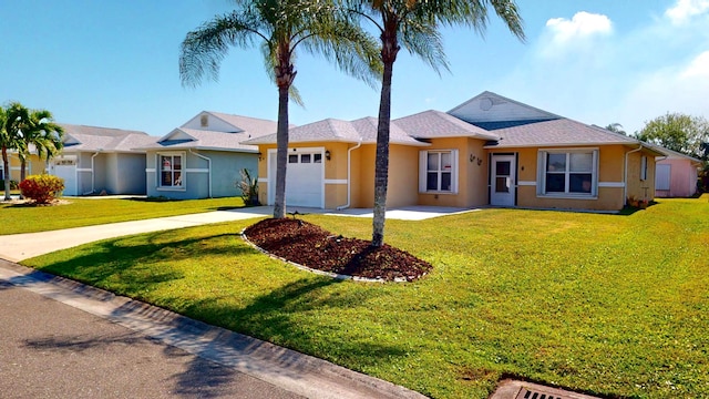 413 European Ln, Fort Pierce, FL 34982 - single story home featuring stucco siding, driveway, a front lawn, and a garage