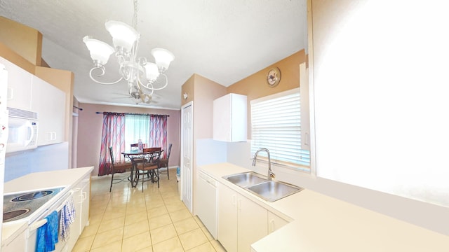 413 European Ln, Fort Pierce, FL 34982 - kitchen with a sink, white appliances, a notable chandelier, and light countertops