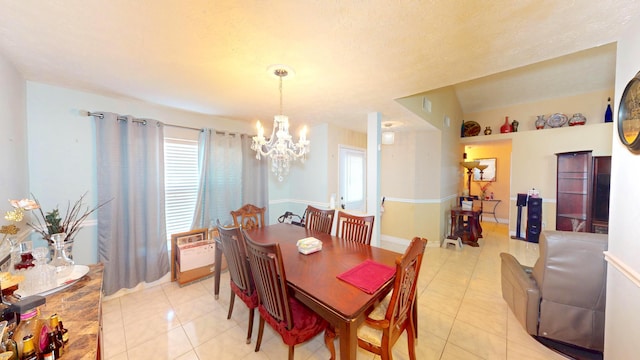 413 European Ln, Fort Pierce, FL 34982 - dining room with light tile patterned floors, plenty of natural light, and a chandelier