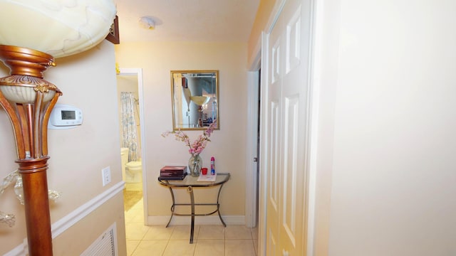 413 European Ln, Fort Pierce, FL 34982 - corridor with light tile patterned flooring, visible vents, and baseboards
