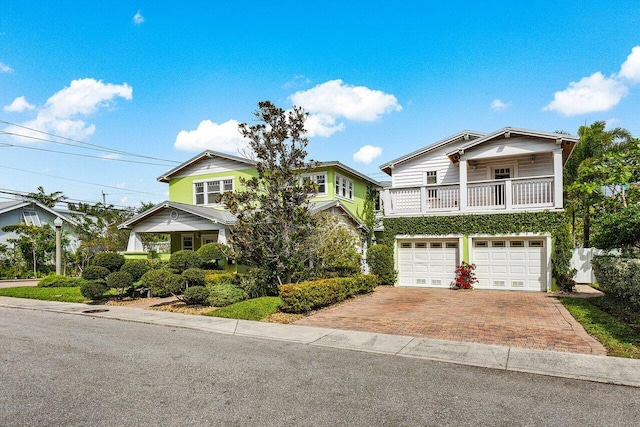 view of front facade with decorative driveway and an attached garage