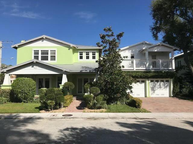 view of front of house featuring decorative driveway, an attached garage, and stucco siding