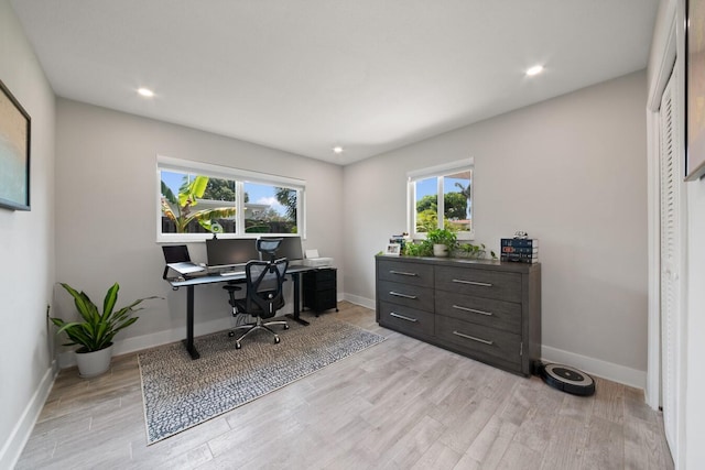 office featuring light wood-style flooring and baseboards