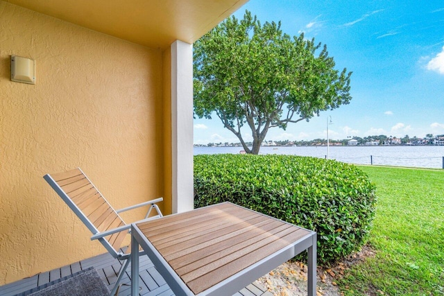 balcony featuring a water view