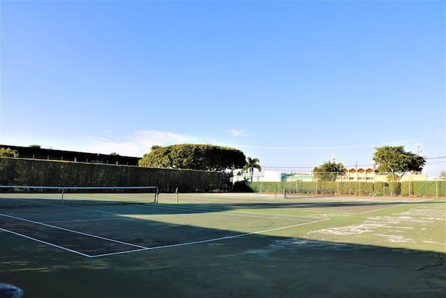 view of sport court featuring fence