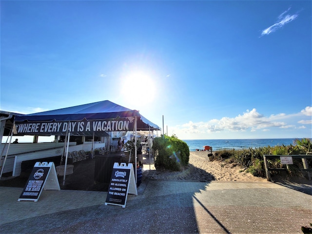 view of home's community with a view of the beach and a water view