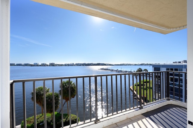 balcony featuring a water view