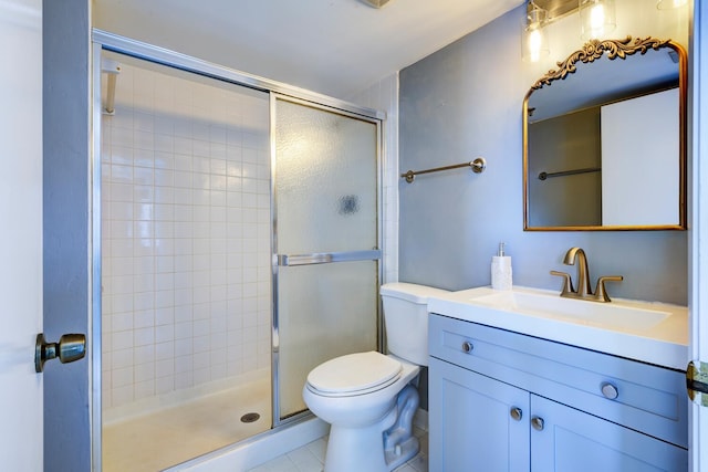 bathroom featuring toilet, a stall shower, tile patterned floors, and vanity