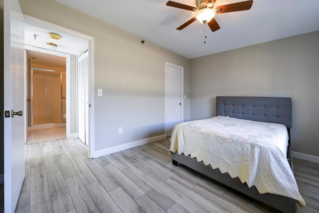 bedroom featuring a ceiling fan, baseboards, and wood finished floors