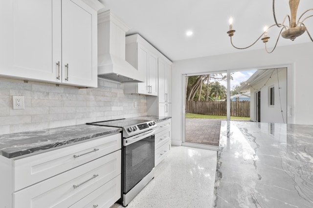 kitchen featuring premium range hood, electric range, stone countertops, and backsplash