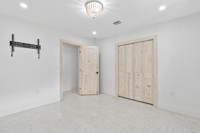 unfurnished bedroom with baseboards, a closet, visible vents, and recessed lighting