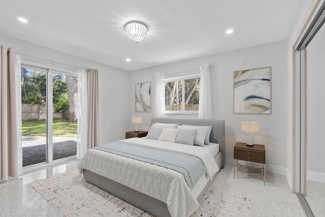 bedroom featuring light speckled floor, recessed lighting, and access to outside