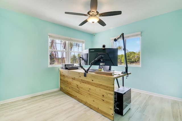 office with ceiling fan, baseboards, and wood finished floors