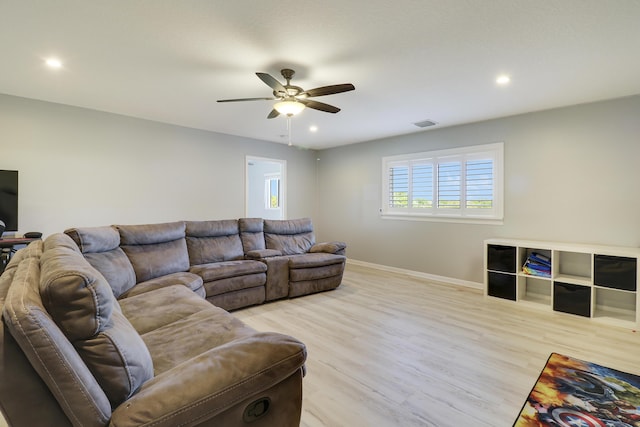 living area with visible vents, baseboards, a ceiling fan, light wood-style flooring, and recessed lighting