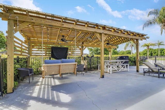 view of patio featuring a ceiling fan, fence, and an outdoor hangout area