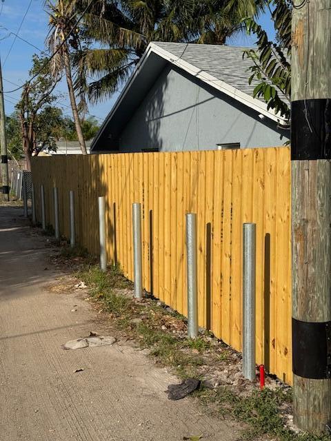 view of property exterior featuring fence