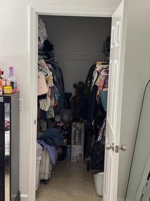 spacious closet with tile patterned flooring